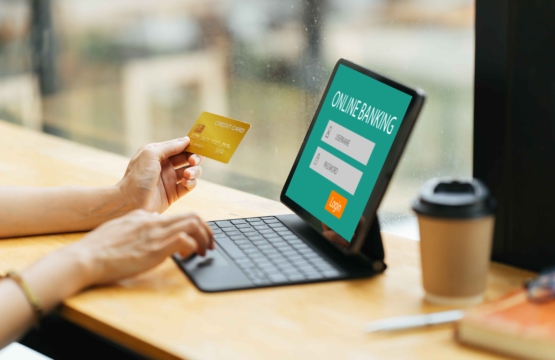 vecteezy smiling woman paying online using laptop holding plastic 7389892 1 1