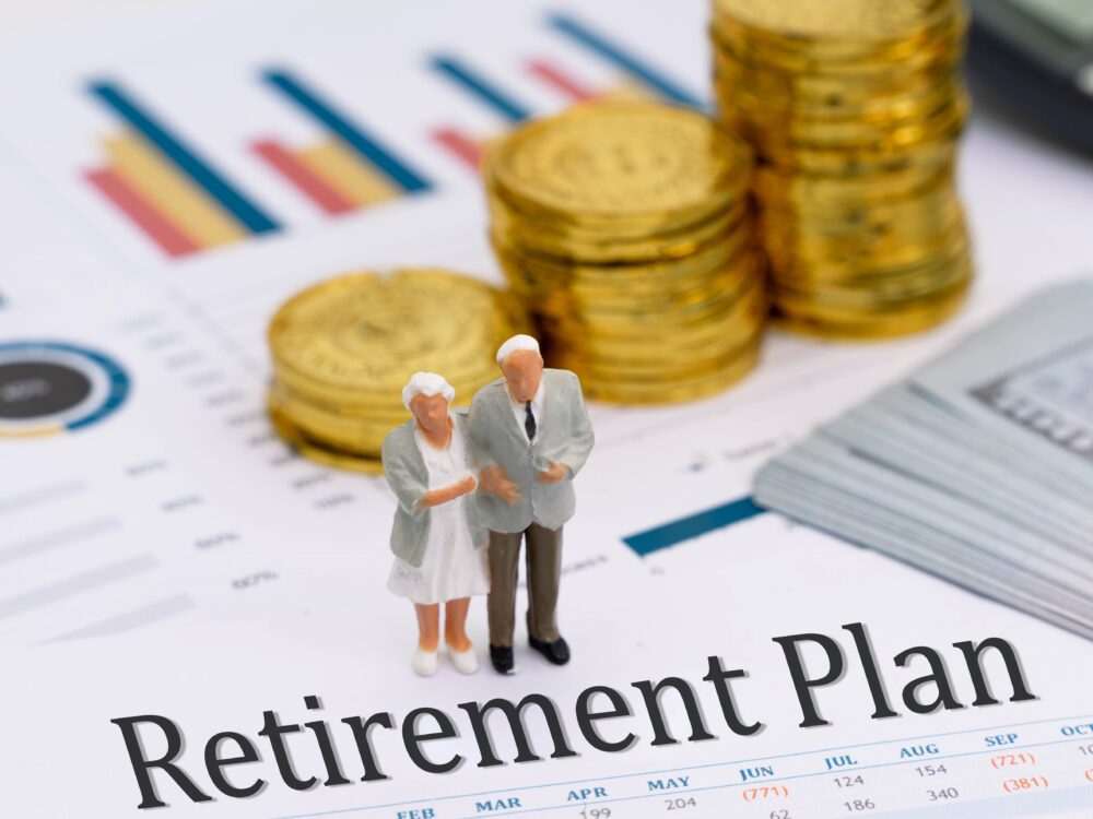 miniature model senior couple standing retirement plan report scaled 1